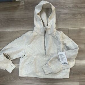 Heathered bone scuba half zip. Brand new. Size XS/S
